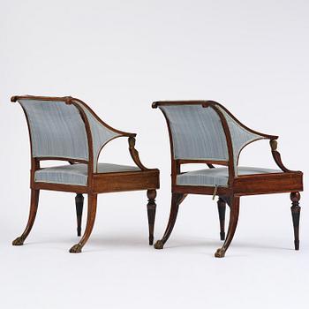 A pair of late Gustavian mahogny armchairs.