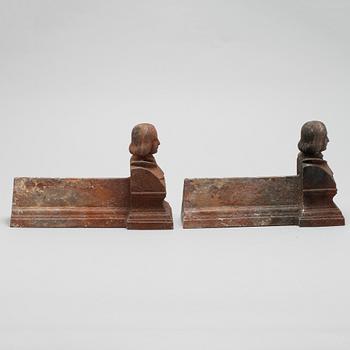 A pair of fire stands from the 20th century.