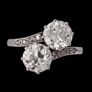 1388. An old cut two stone diamond ring, each app. 1.30 cts.