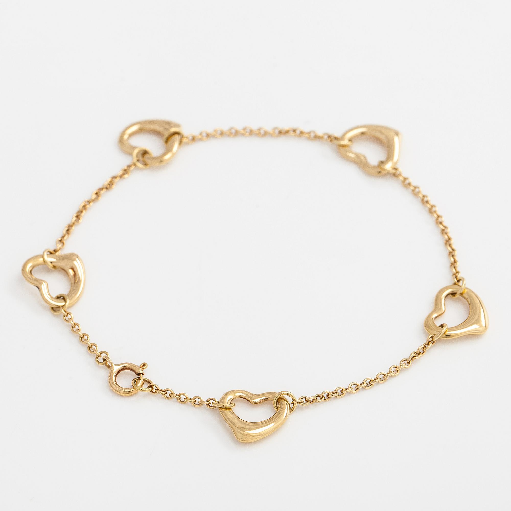 Tiffany & Co, Elsa Peretti, an 18K gold 'Open Heart' bracelet.