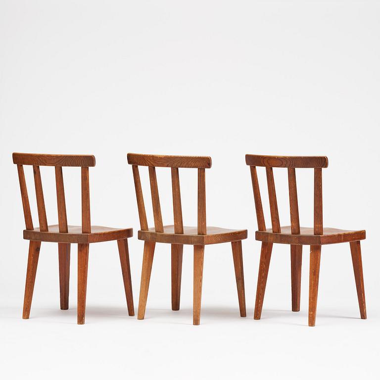 Axel Einar Hjorth, a set of three stained pine "Utö" chairs, Nordiska Kompaniet, Sweden, 1930s.