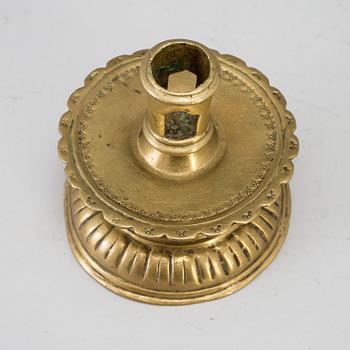 A 16th century bronze candlestick.