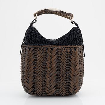 Yves Saint Laurent, a rattan and horn handbag.