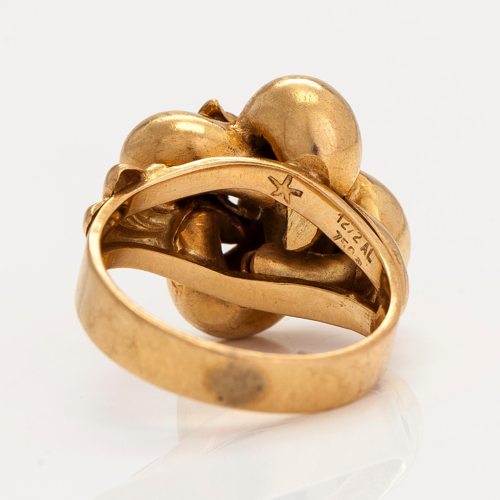 An 18K gold ring. Foreign hallmarks.