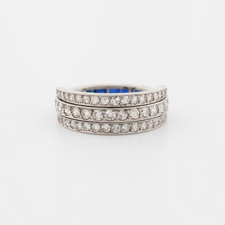 A square cut sapphire and single cut diamond ring.