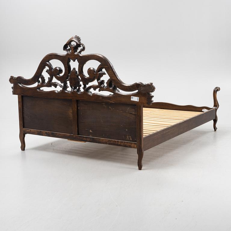 A rococo style bed frame, around 1900.