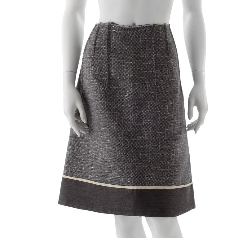 MARNI, a grey wool blend skirt with silver treads.