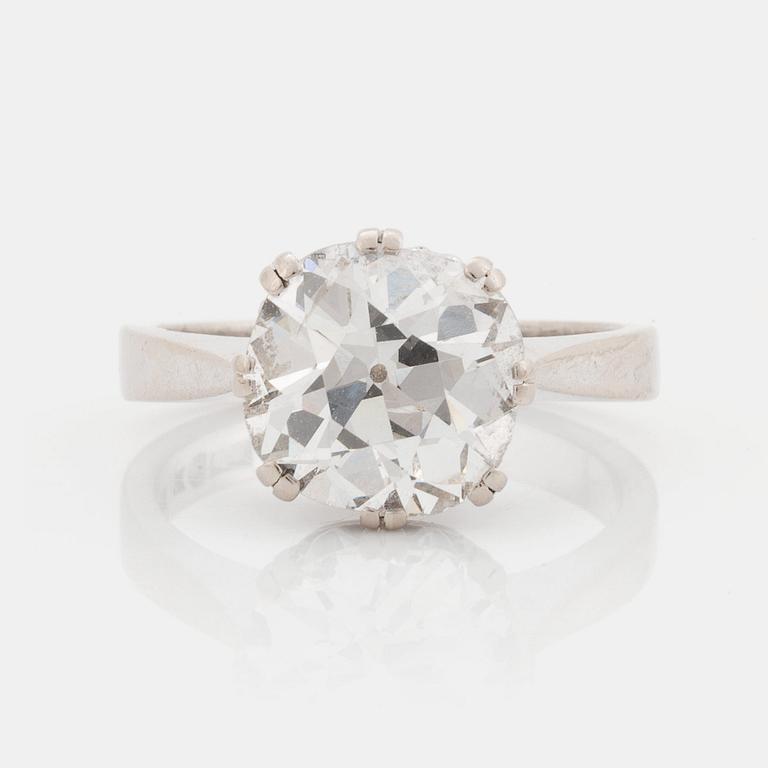 An 18K white gold ring set with a cushion formed old cut-diamond.