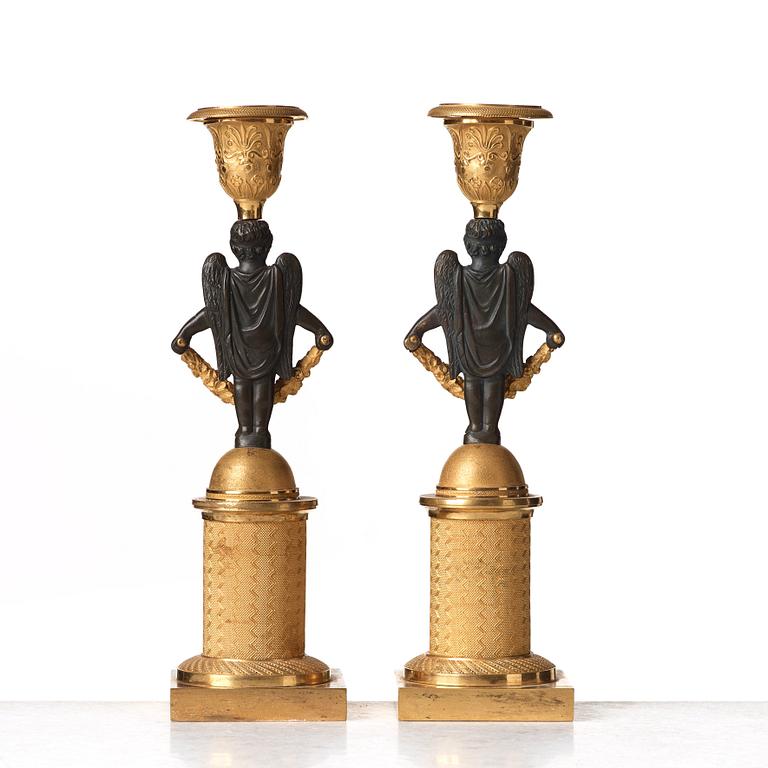 A pair of Empire early 19th century candlesticks.