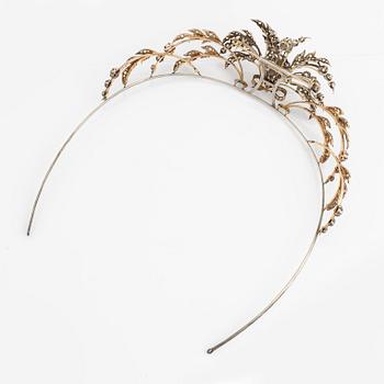 A brooch/tiara combination.