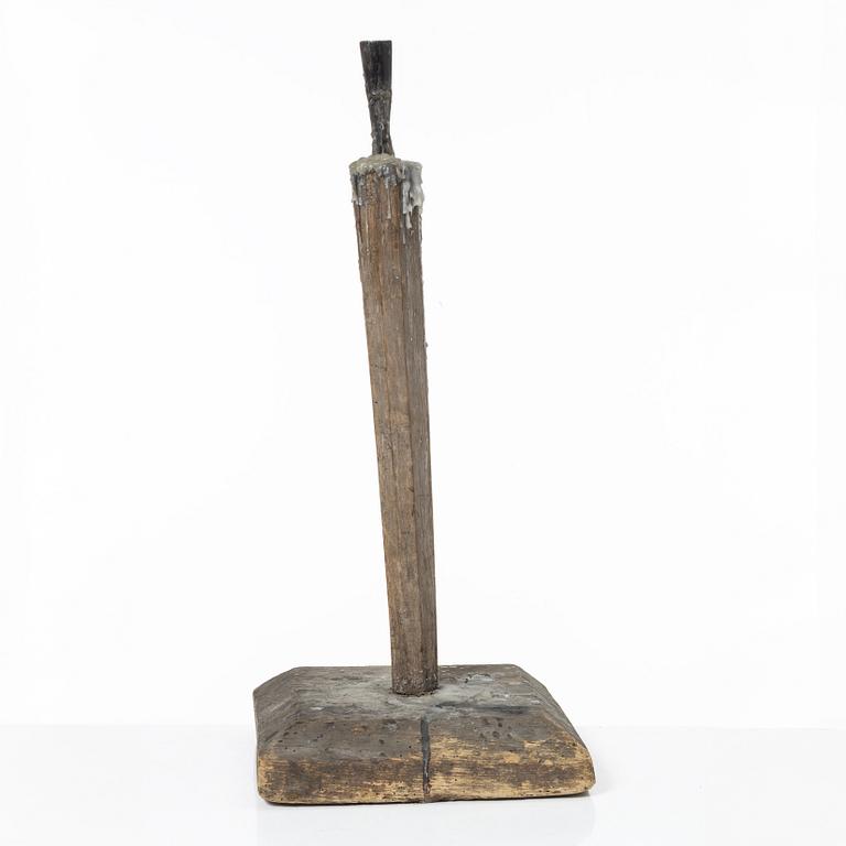 A candle stick, 19th/20th Century.