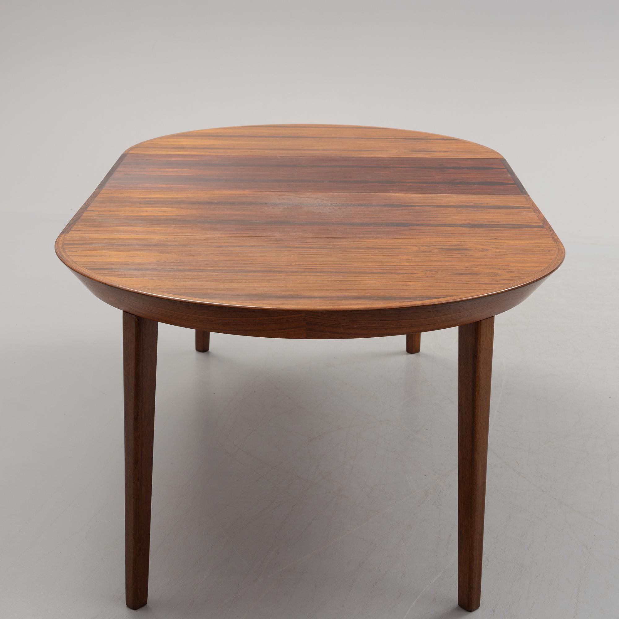A 1950s/1960s rosewood veneer table.