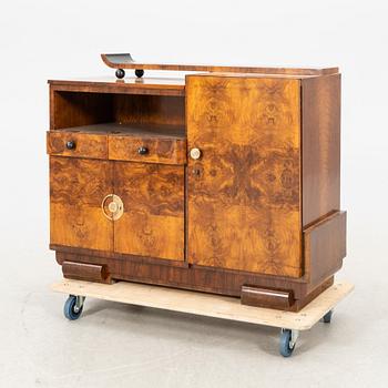 A walnut veneered Art Déco cabinet.