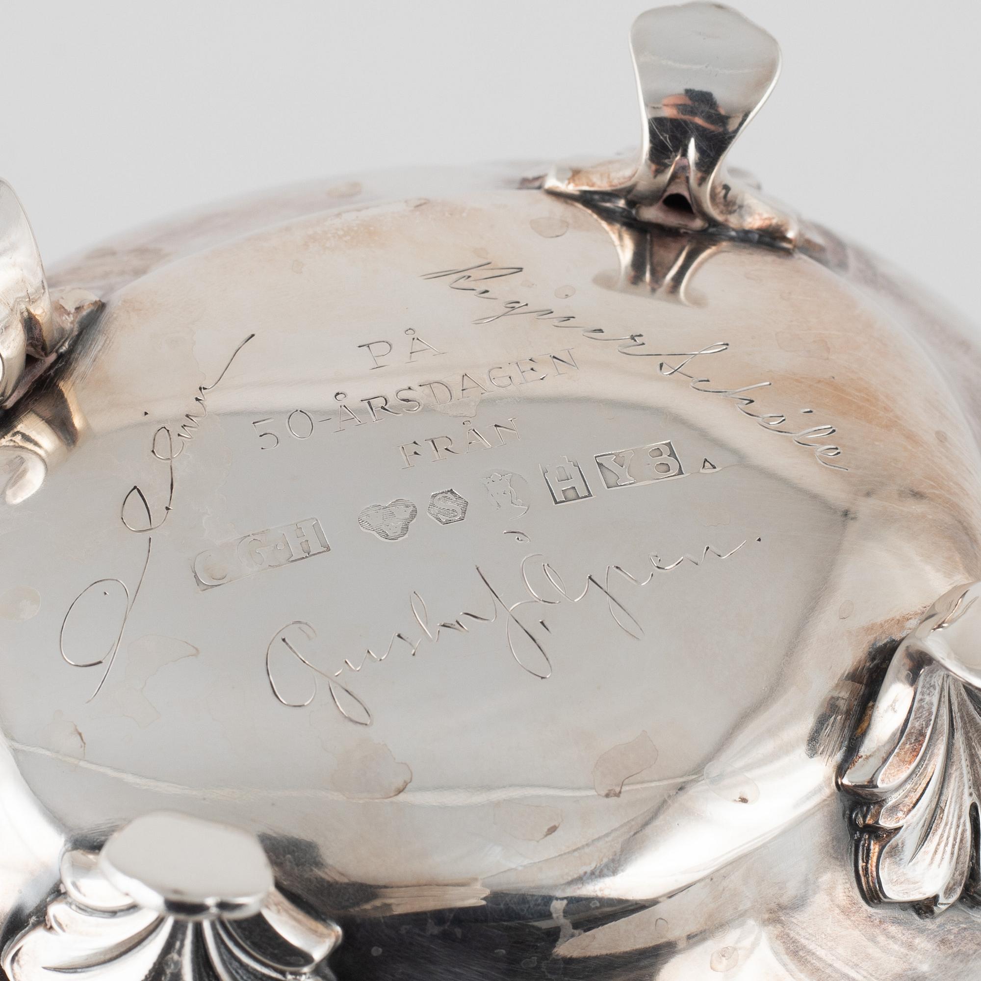 A silver coffee pot with creamer and sugarbox. CG Hallberg, Stockholm 1946.
