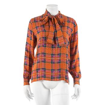 672. YVES SAINT LAURENT, a patterned blouse, size 38.