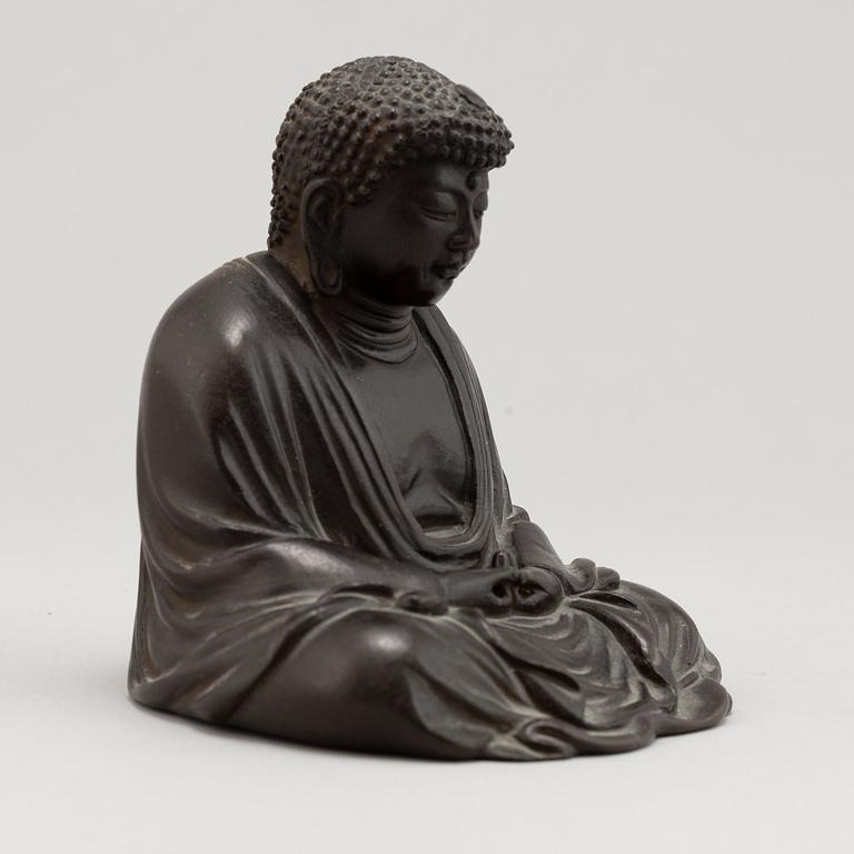 A Japanese seated bronze okimono of Amitabha buddha, 20th century.