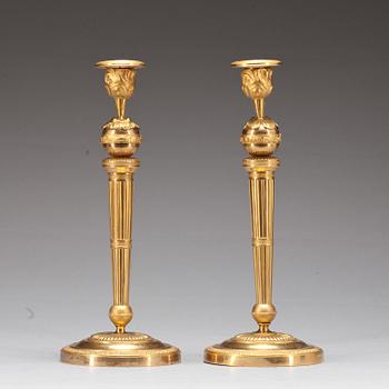 559. A pair of Empire early 19th century candlesticks.