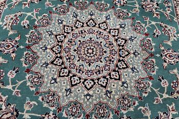 A Nain carpet, part silk, 6 laa, c. 300 x 201 cm.