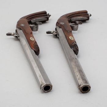A mid 19th century pair of percussion pistols.