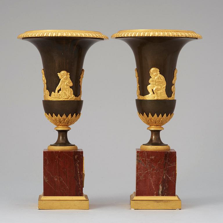 A pair of French Empire early 19th century urns.