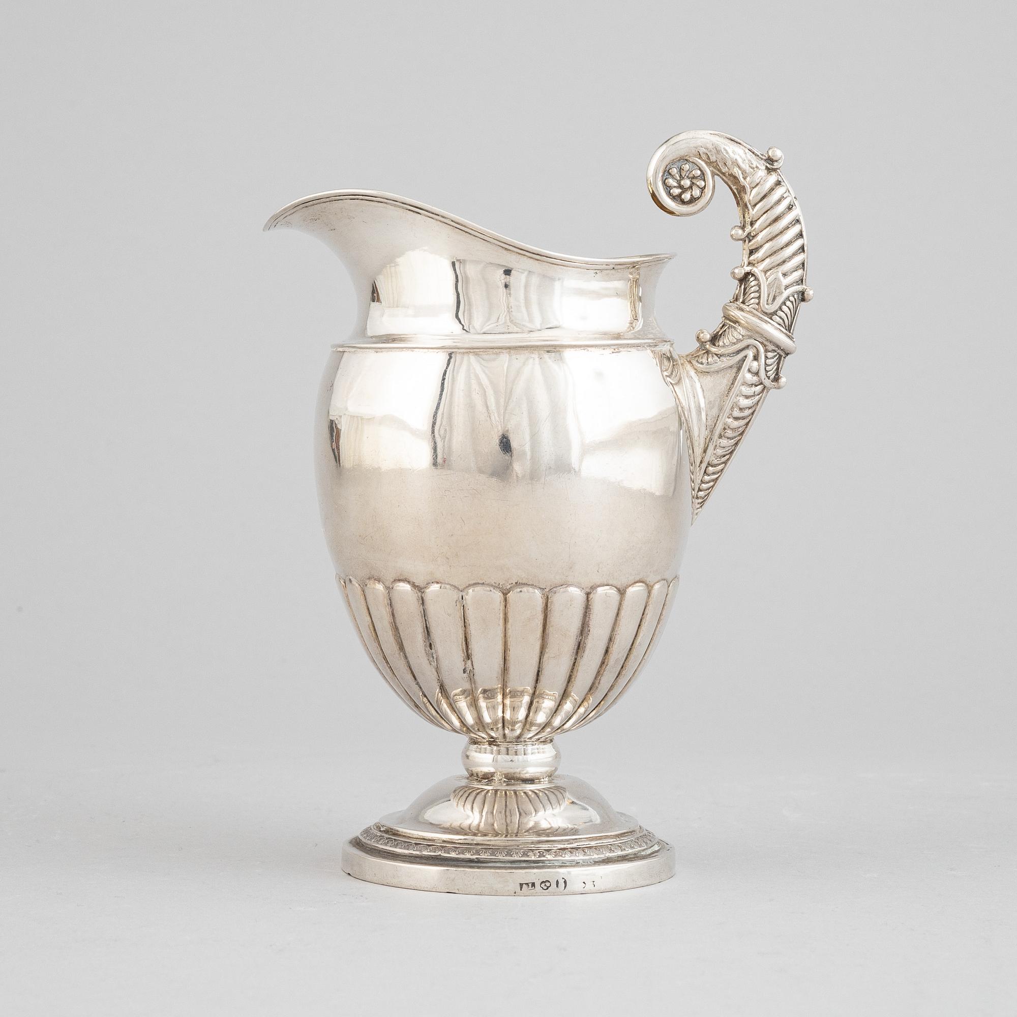 A Swedish empire parcel gilt silver creamer, mark of Anders Lundqvist, Stockholm 1828.