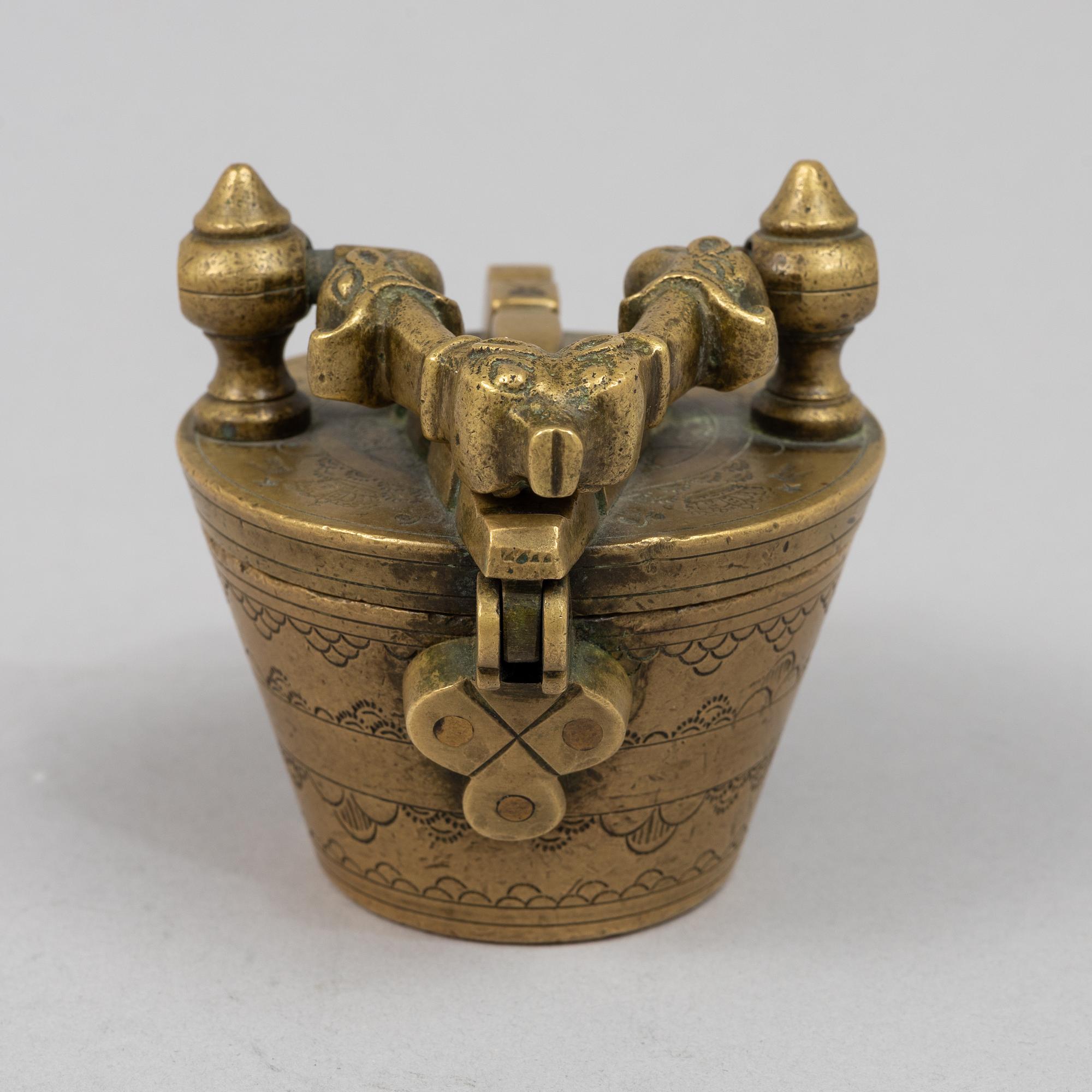A brass weight set, late 19th century.
