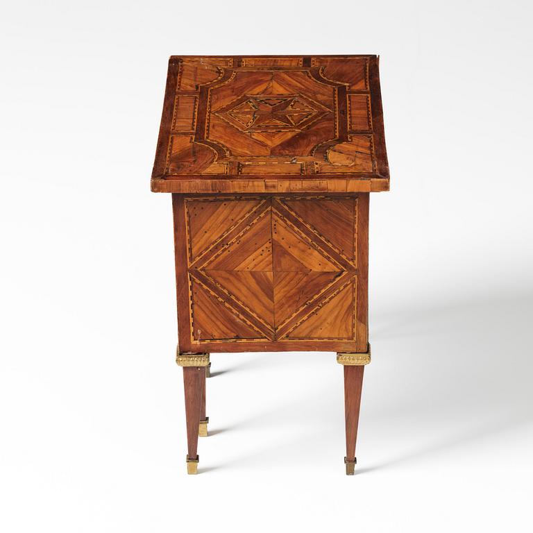 A Louis XVI parquetry miniature commode, late 18th century.