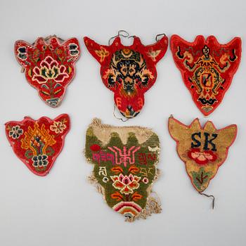 A group of six Tibetan takyabs or "horse jewels", early 20th century.