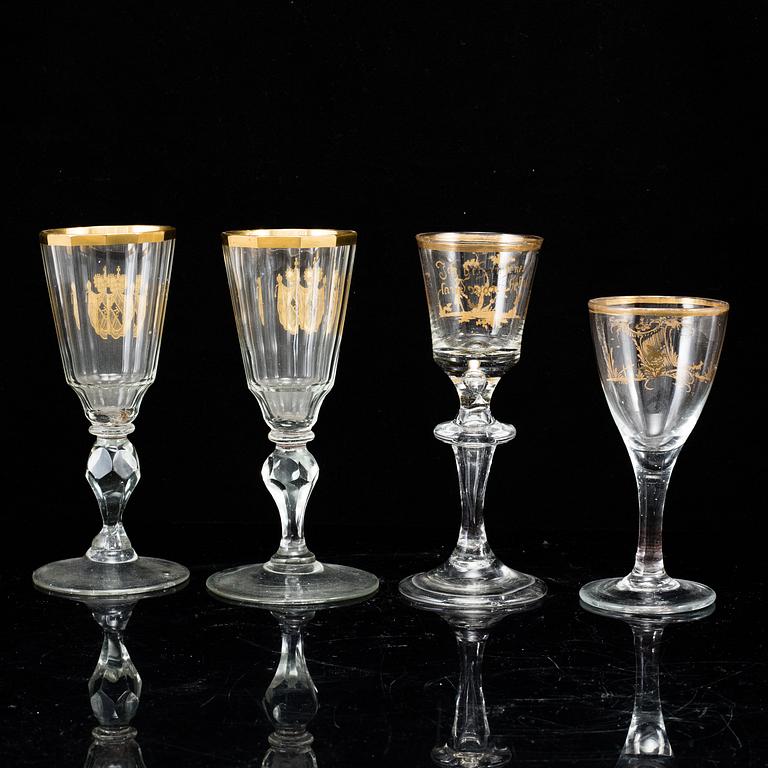 A set of four odd glasses, early 19th Century.