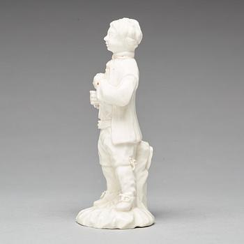 A Swedish Marieberg soft paste figure of a man with a bird, 18th Century.