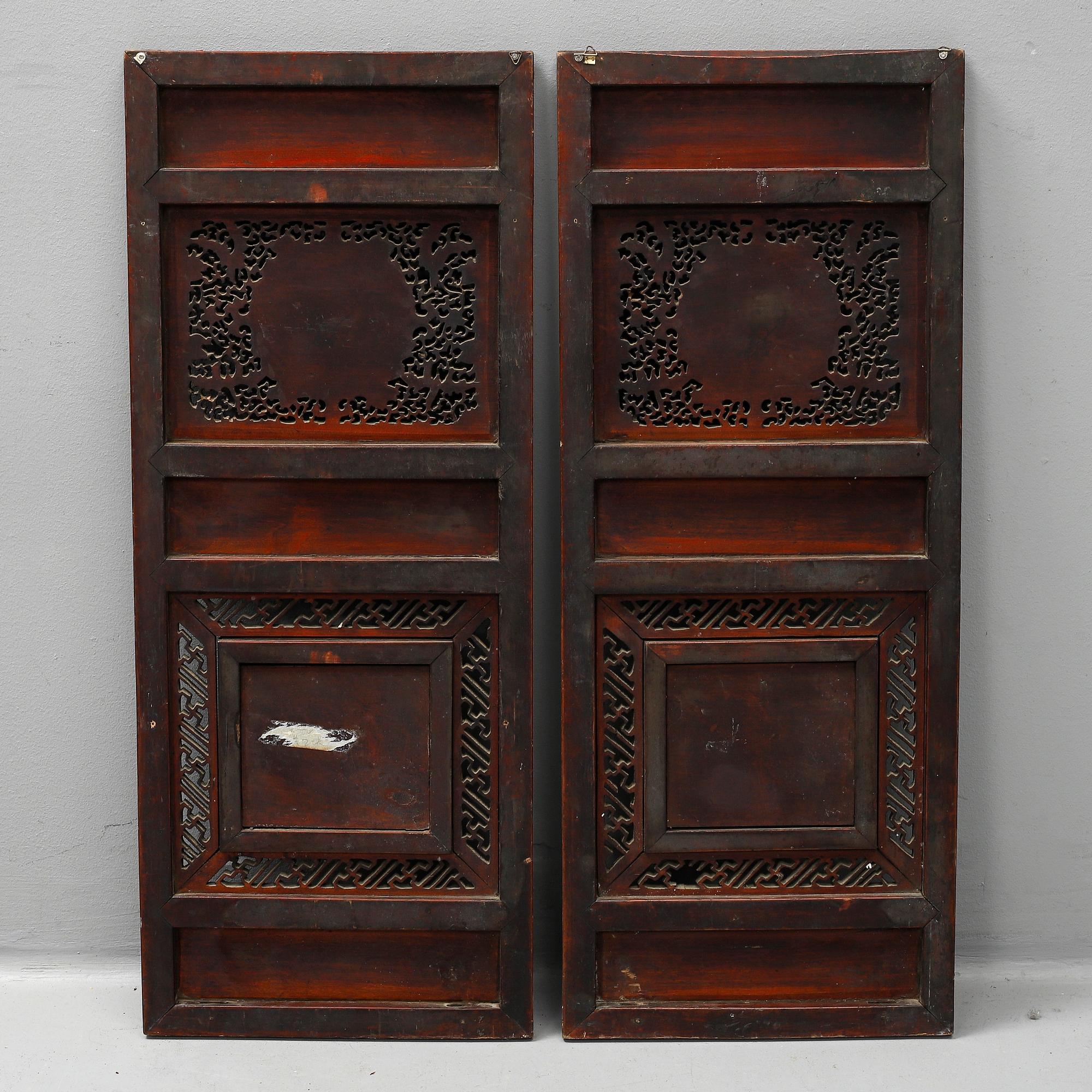 Two Chinese wooden carved panels, 20th century.
