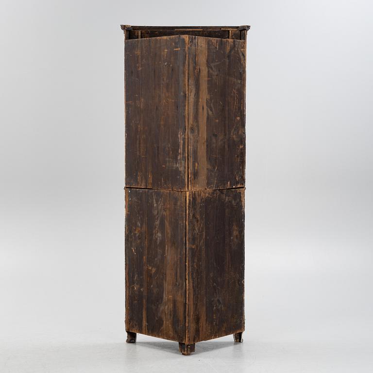 A gustavian style painted corner cabinet, 19th century.
