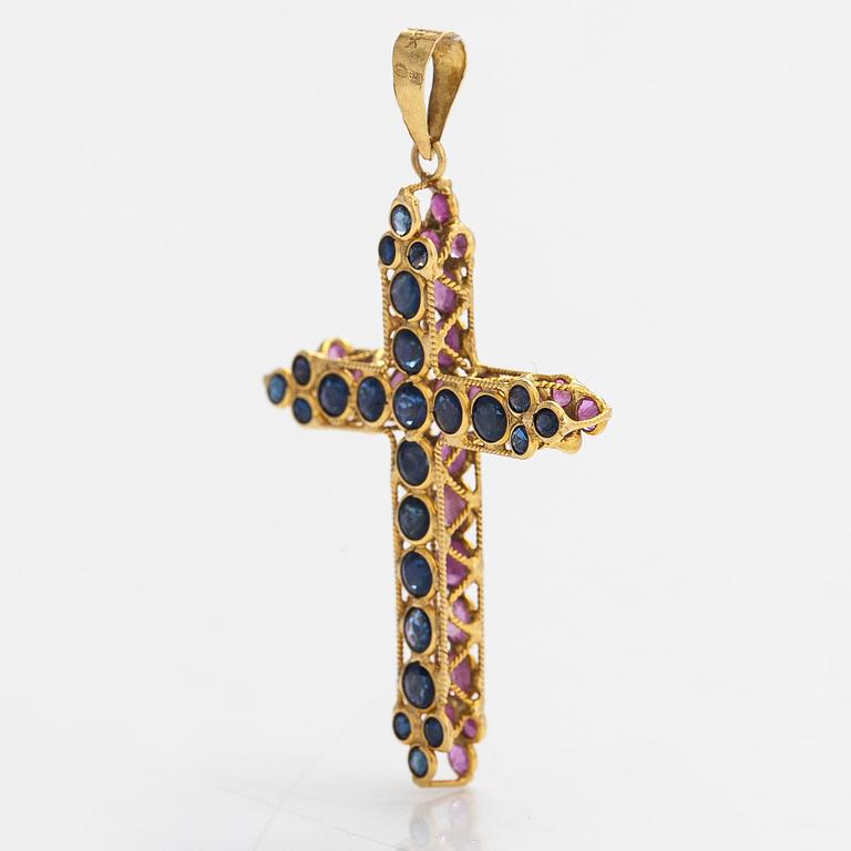 An 18K gold cross pendant with sapphires. Finnish import marks.