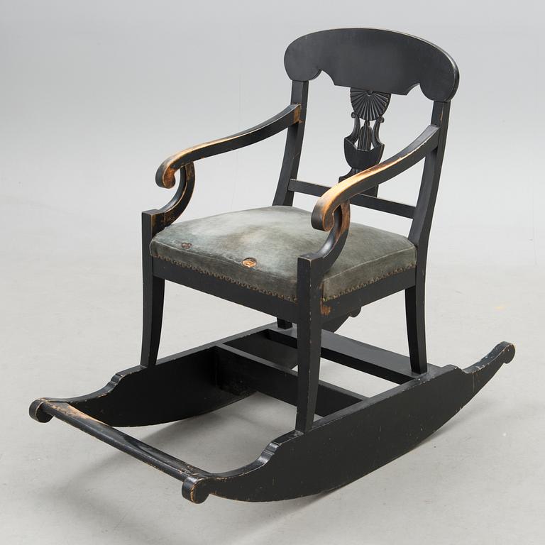 An empire style rocking chair from the end of the 19th Century.