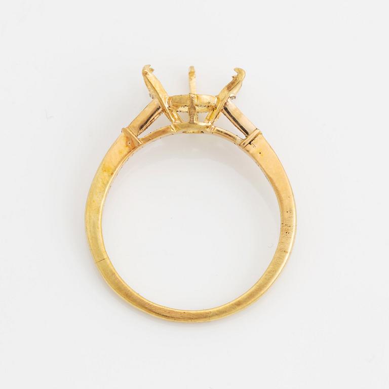 An 18K gold ring set with a round brilliant-cut diamond weight 3.30 cts quality E vs2.