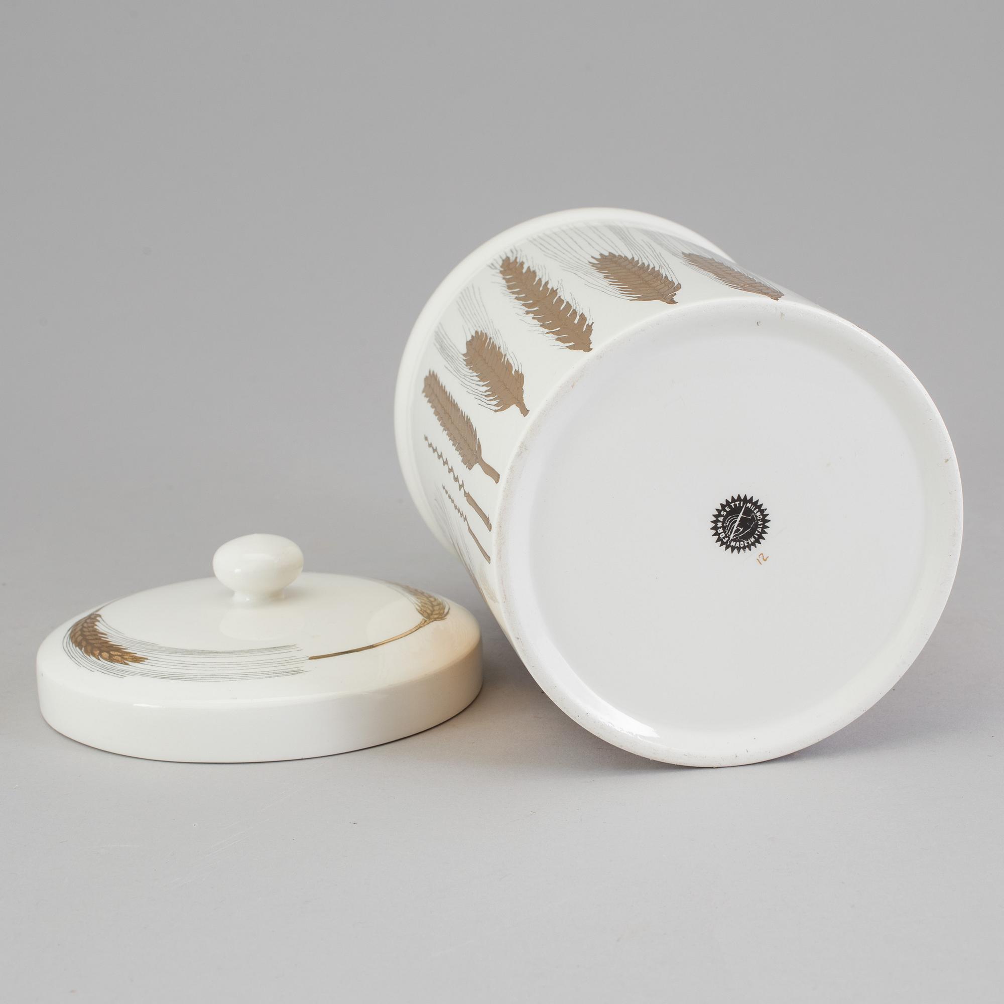 A porcelain jar with lid from Fornasetti, Italy.