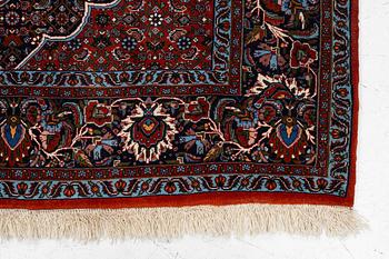 An Oriental rug, approx. 213 x 201 cm.