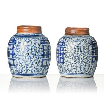 A pair of blue and white porcelain pots with covers, China, 19th century.