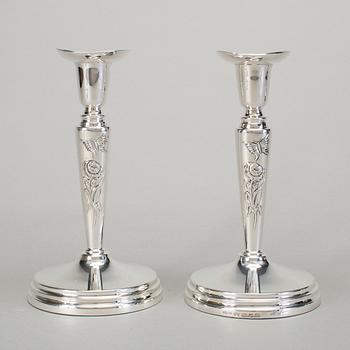 A pair of silver candlesticks by Meya Lerible for Mema, Linköping 1994.