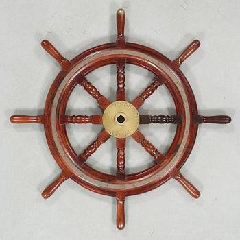 A ship wheel from John Hastie & Co, Greenrock, 20th century.