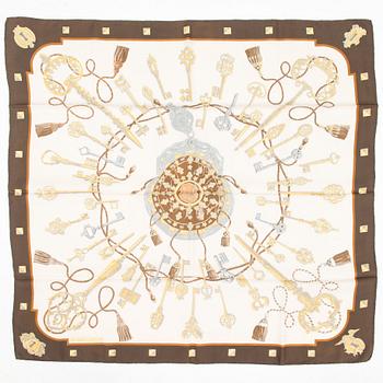 Hermès, Two silk scarves, 'Les Voitures a Transformation' and 'Les Clefs'.