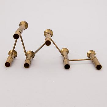 A 1970s 'Nonstop' brass serial candelabra by Hopeakeskus, Finland.