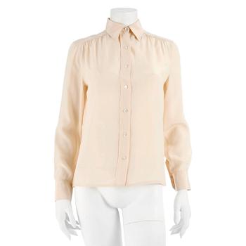 CÉLINE, a créme colored silk blouse, size 40.