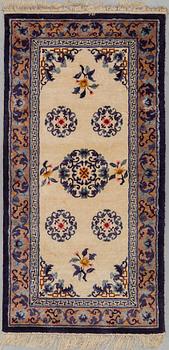 A CARPET, Old silk China, ca 187 x 95 cm.