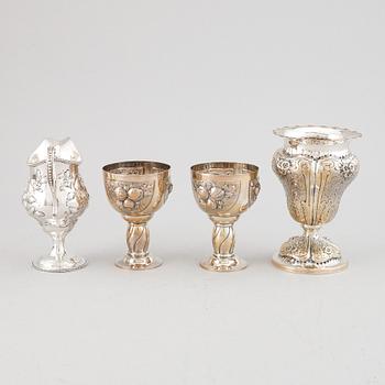 A mixed lot of two beakers, a vase and a jug, Baroque style, silver 830, 20th century.