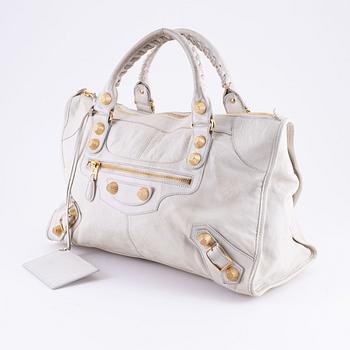 Balenciaga, a white leather 'City' bag.