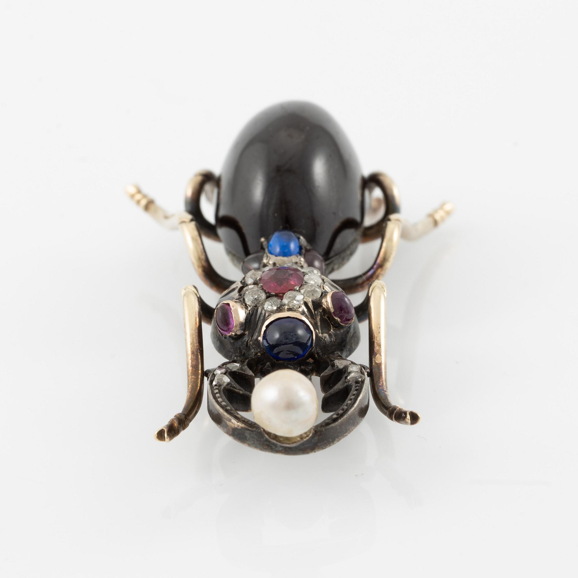 Brooch, in the form of an insect, 14K gold with garnet, diamonds, ruby, sapphire, and pearl.