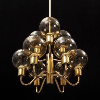 Hans-Agne Jakobsson, a late 20th century brass and glass ceiling lamp for nine lights, Markaryd, Sweden.