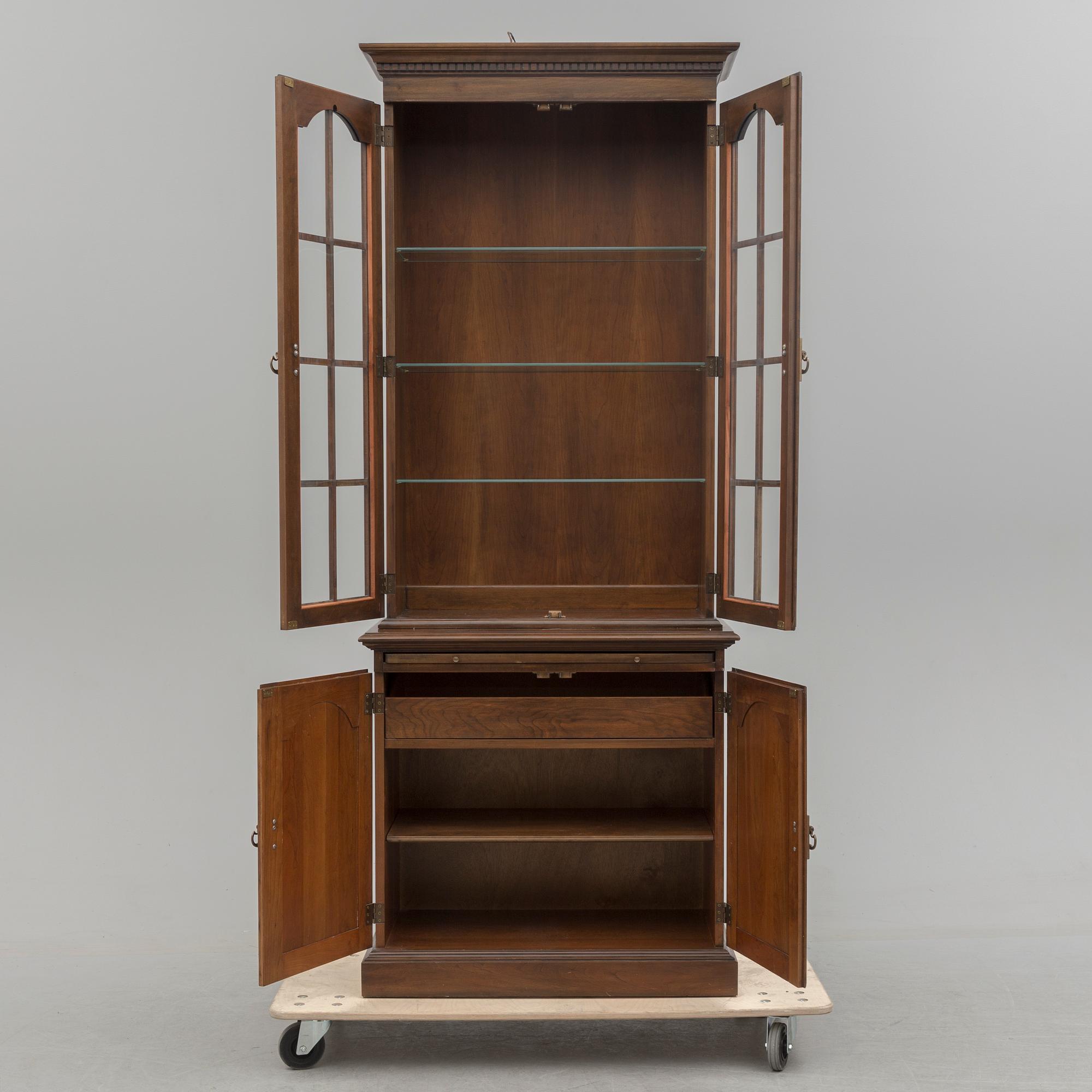 A second half of the 20th century vitrine cabinet marked "Pennsylvania House".