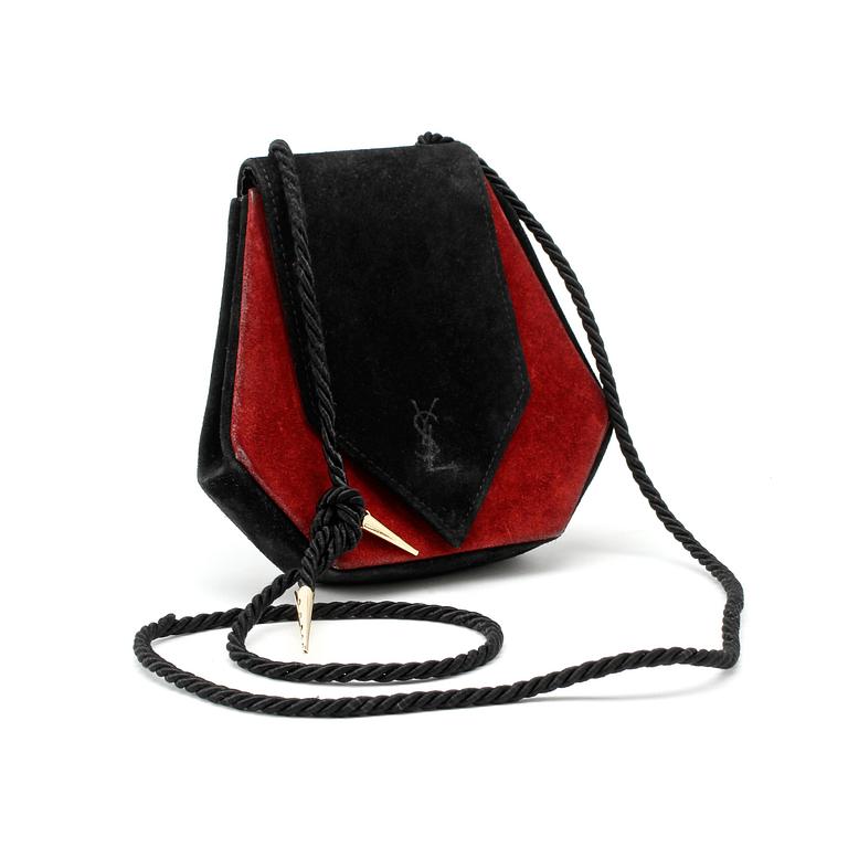 YVES SAINT LAURENT, a black and red suede shoulder bag from the 1960s.